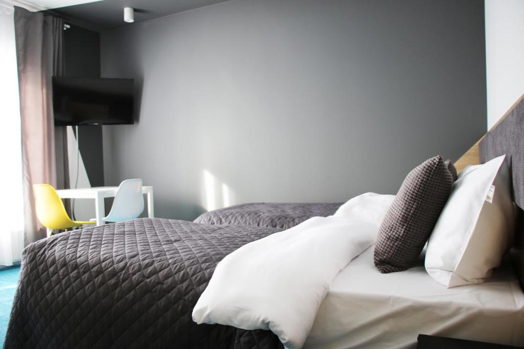 Posteľ alebo postele v izbe v ubytovaní Lemon Plaza Hotel
