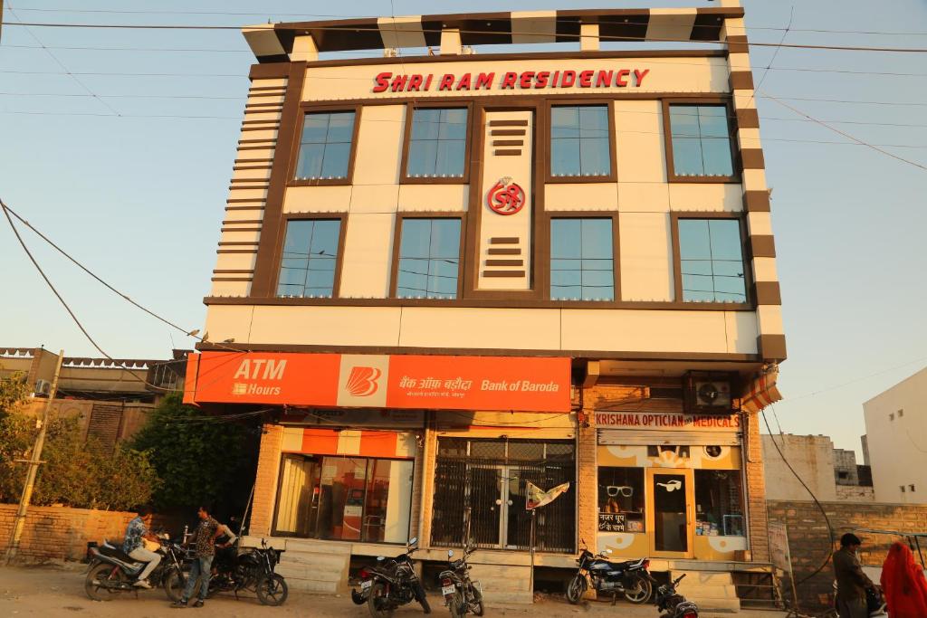 a building with motorcycles parked in front of it at Shri Ram Residency in Jodhpur
