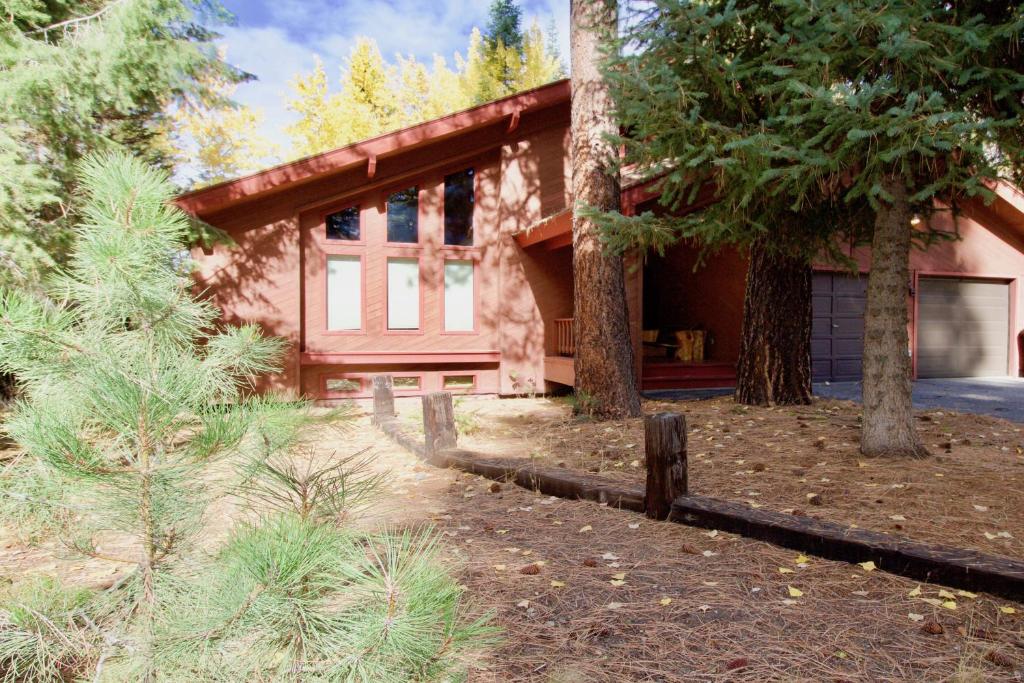 a house with a fence in front of it at Stedman Cabin in McCall