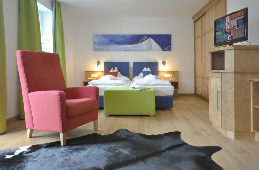 Postel nebo postele na pokoji v ubytování Impuls Hotel Tirol