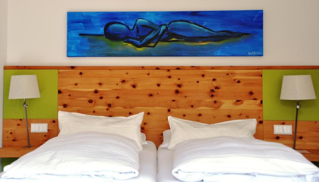 Postel nebo postele na pokoji v ubytování Impuls Hotel Tirol
