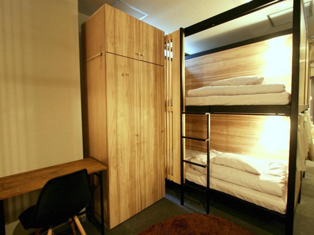 Postel nebo postele na pokoji v ubytování Namba Guesthouse HIVE