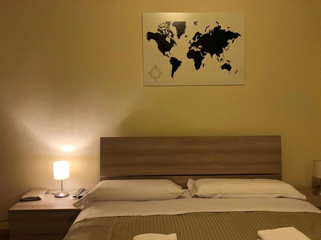 Postel nebo postele na pokoji v ubytování Il Galileo Rooms