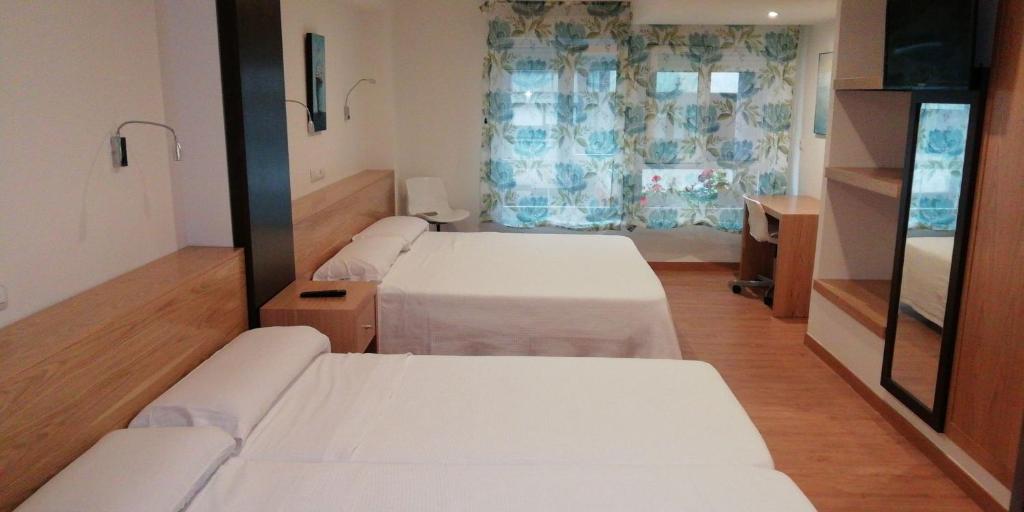 Postel nebo postele na pokoji v ubytování Hostel Costa Gijon