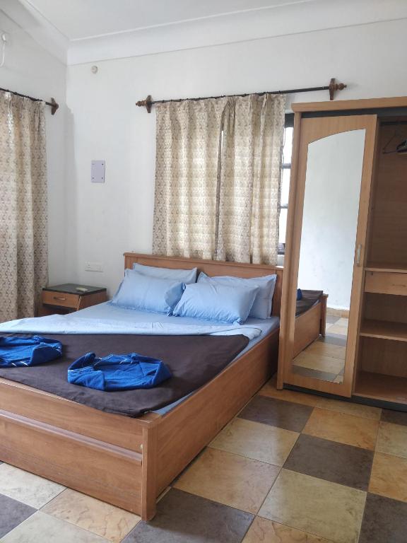 Postel nebo postele na pokoji v ubytování Koito-House calangute guest house