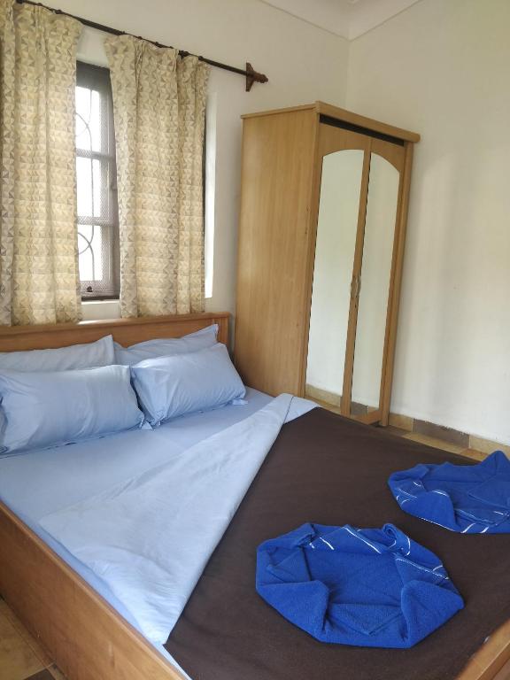 Postel nebo postele na pokoji v ubytování Koito-House calangute guest house