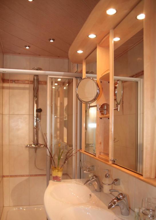 a bathroom with a sink and a mirror at Retzerlandhof Familie Graf in Zellerndorf