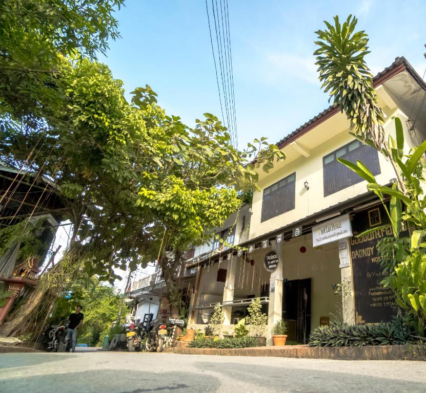 a street with a building on the side of the road at Y Not Laos Hostel in Luang Prabang