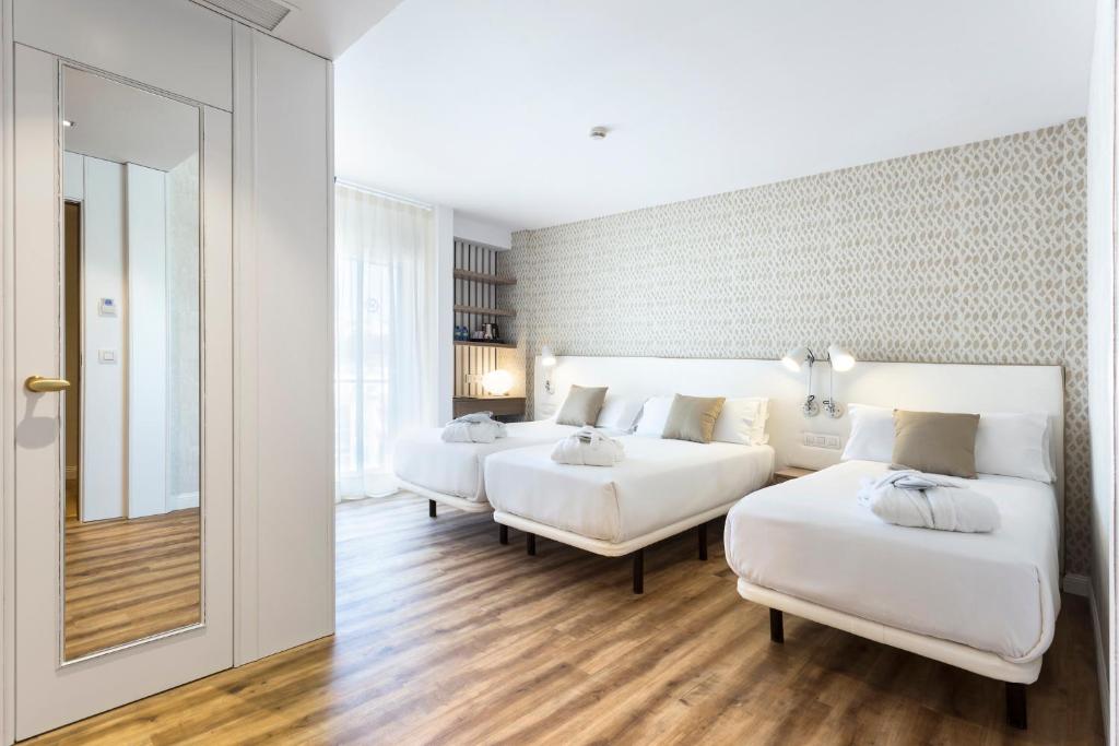 Postel nebo postele na pokoji v ubytování Hotel Anabel