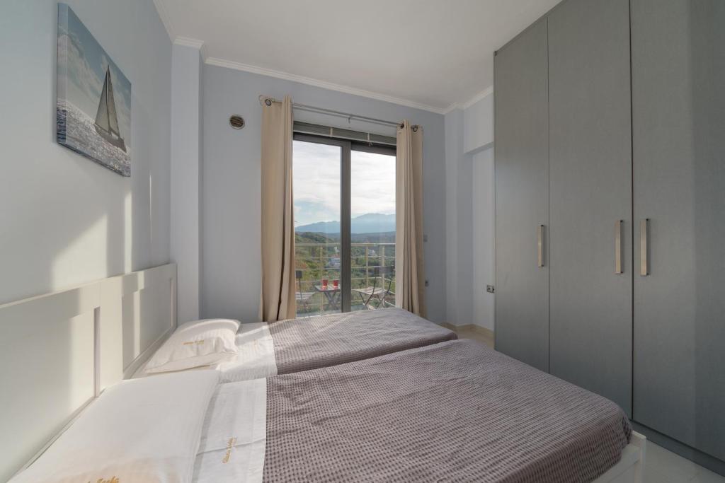 Postel nebo postele na pokoji v ubytování Alexiszorba Villa