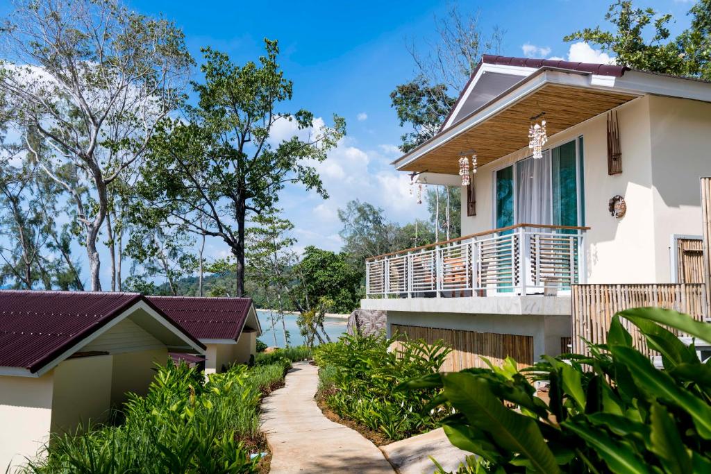 a house with a pathway in front of it at Krabi Home Resort in Tab Kaek Beach