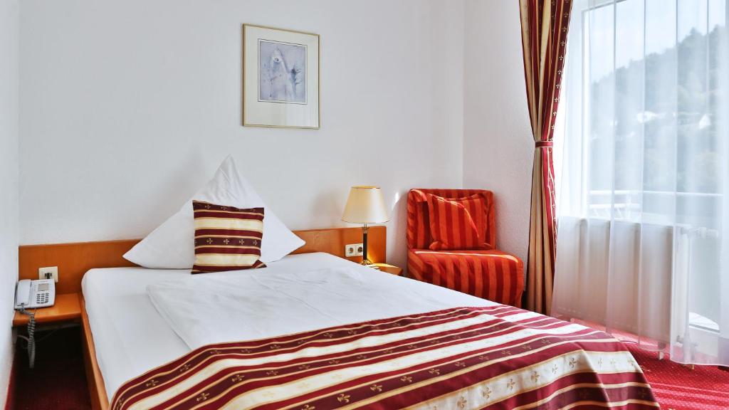Postel nebo postele na pokoji v ubytování Hotel Neckarlux