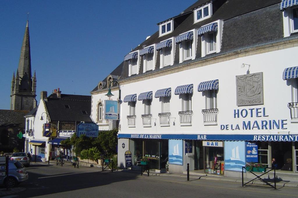 a street in a town with a large building at La Marine in Carnac