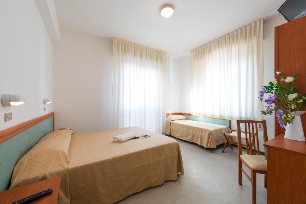 Postel nebo postele na pokoji v ubytování Hotel Sirena