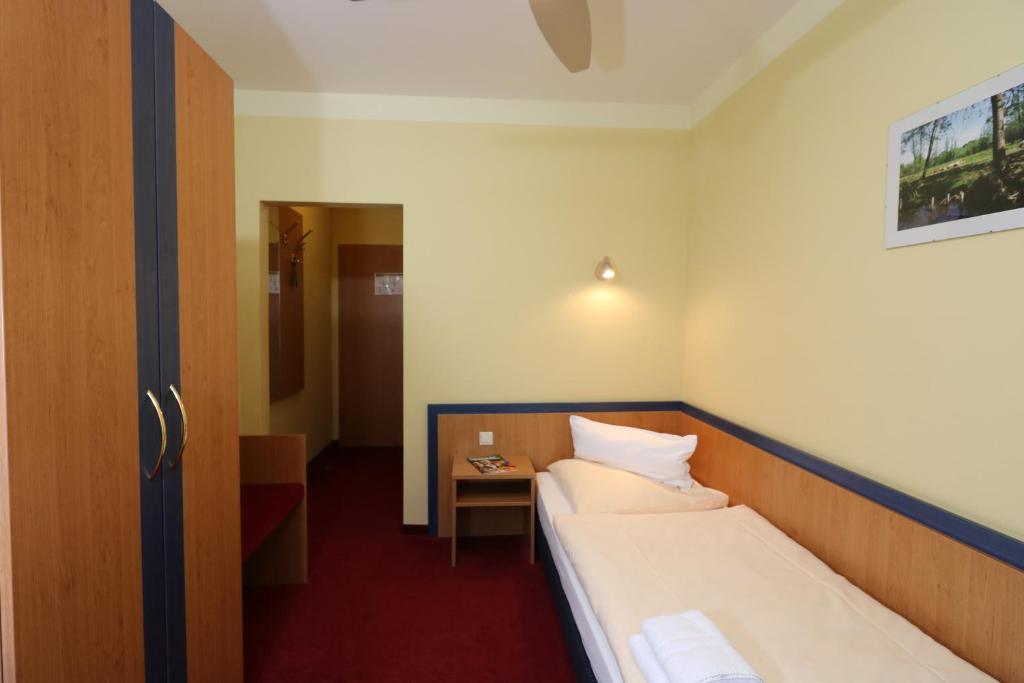 Postel nebo postele na pokoji v ubytování Radduscher Hafen