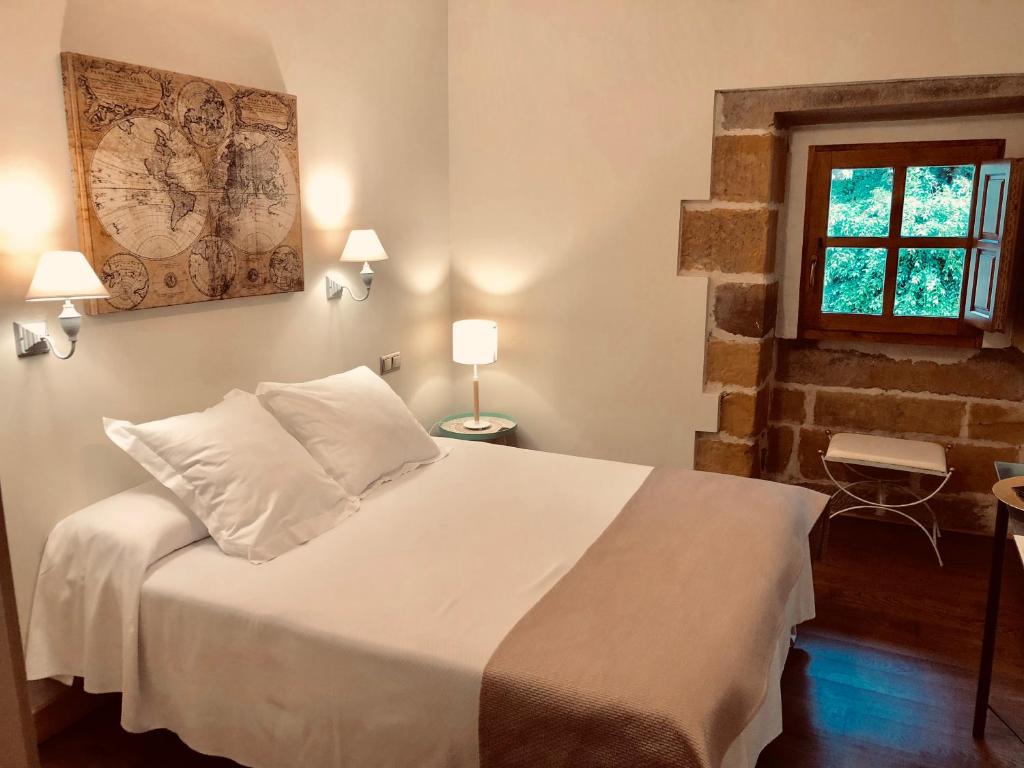 Postel nebo postele na pokoji v ubytování Palacio de Arce