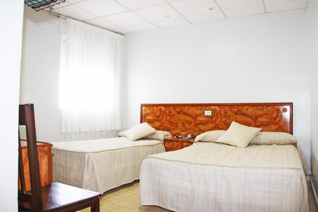Postel nebo postele na pokoji v ubytování Hotel Trabuco
