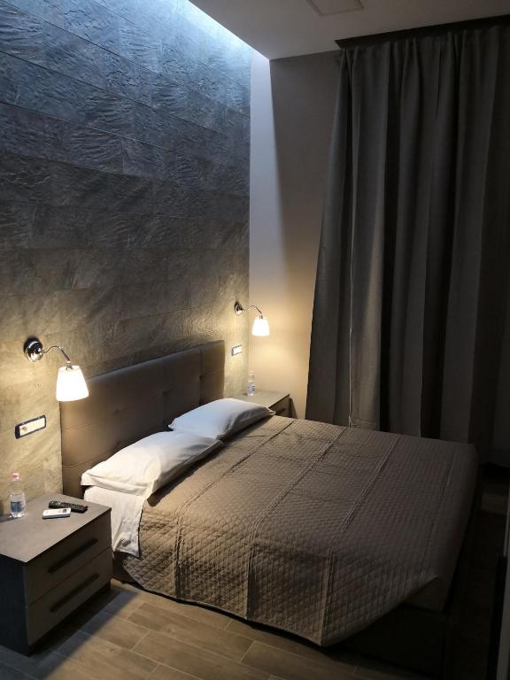 Łóżko lub łóżka w pokoju w obiekcie City Break Nomentana