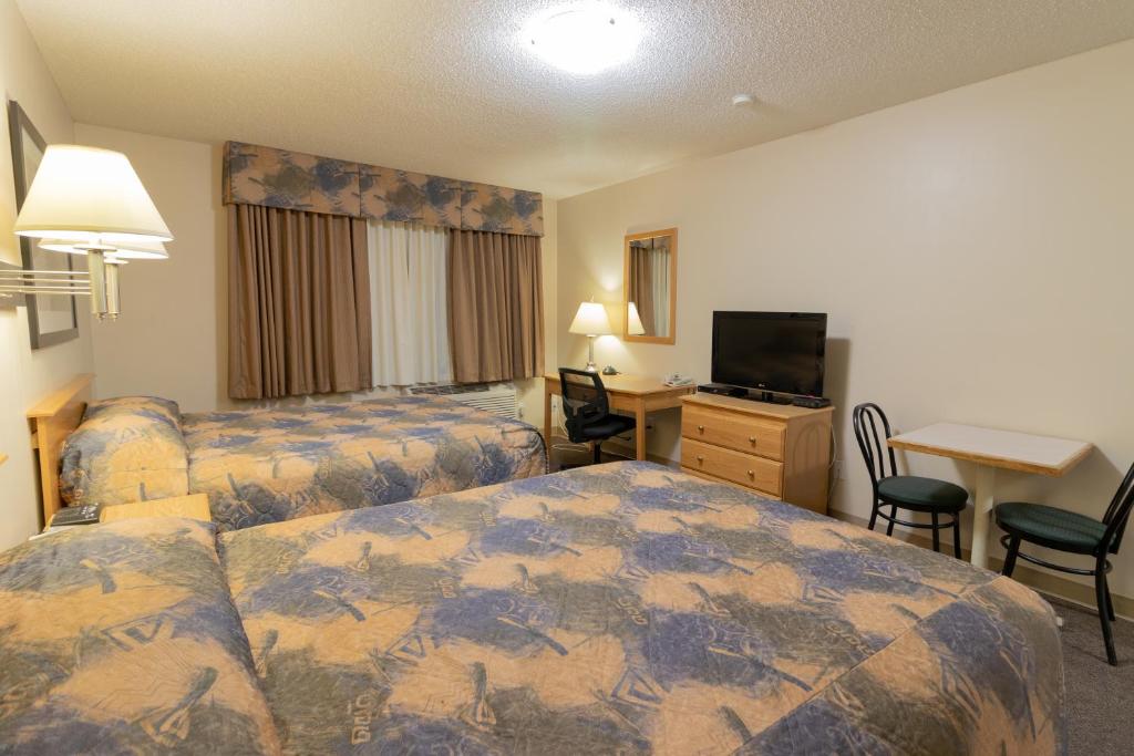 Postel nebo postele na pokoji v ubytování Best Maple Inn - Drayton Valley