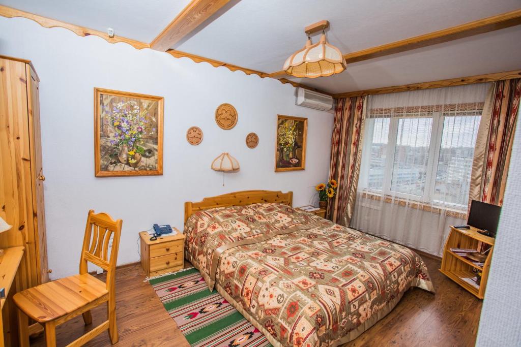 Postel nebo postele na pokoji v ubytování Hotel Mir