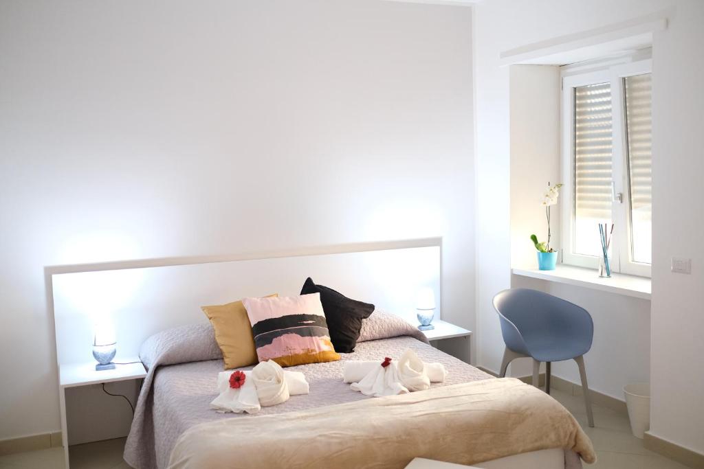 Łóżko lub łóżka w pokoju w obiekcie Hoa Suites
