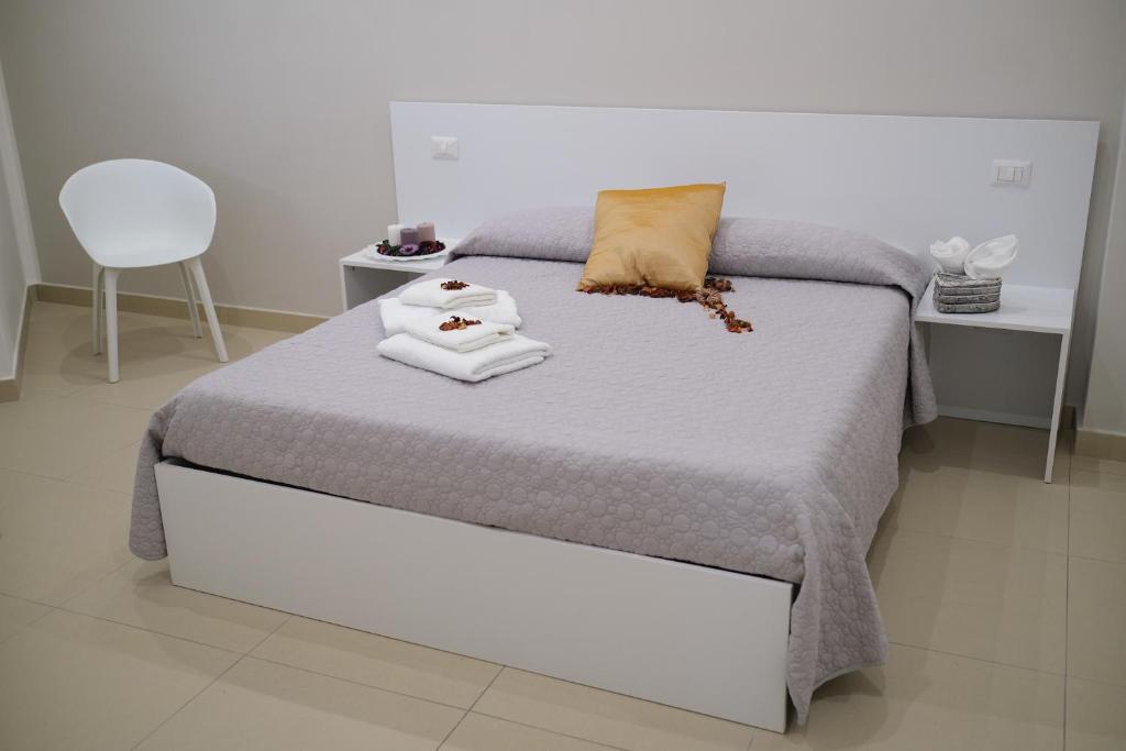 Łóżko lub łóżka w pokoju w obiekcie Hoa Suites