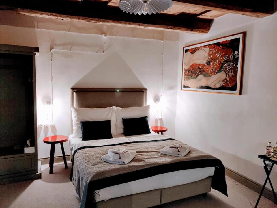 Postel nebo postele na pokoji v ubytování Hotel Kocour