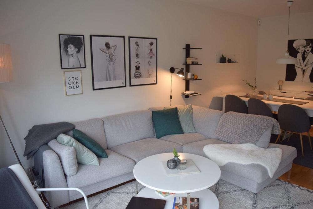 a living room with a couch and a table at BoPrima Villa V5 in Jönköping