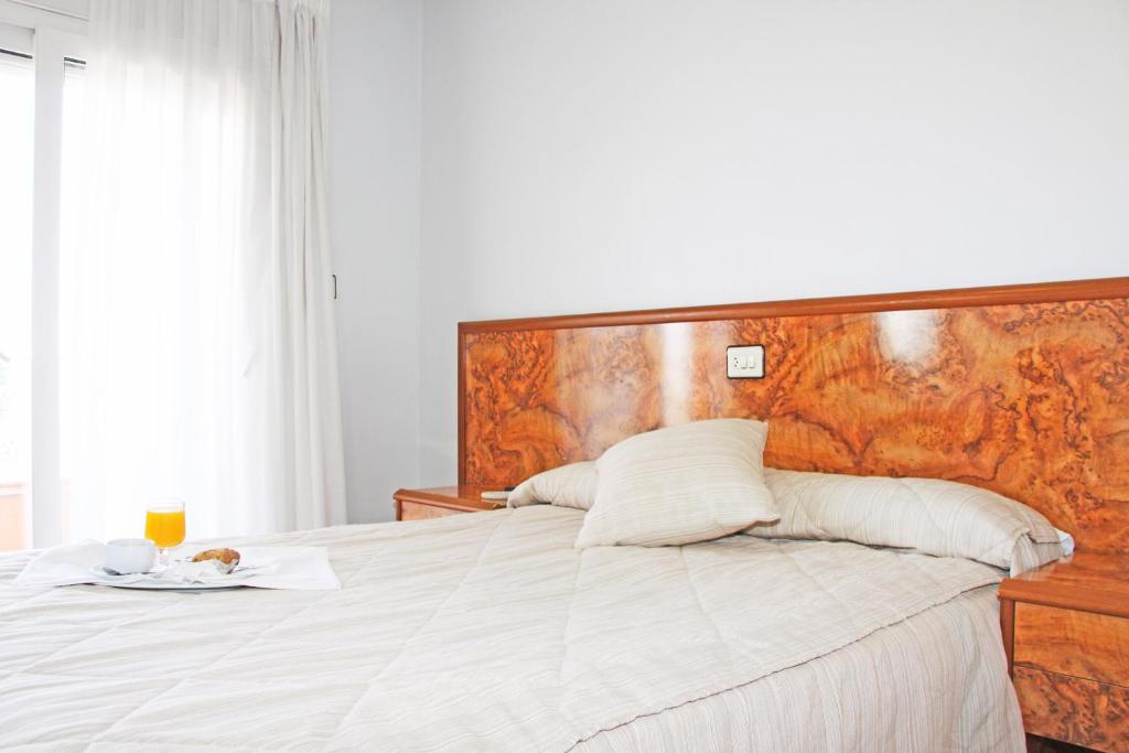 Postel nebo postele na pokoji v ubytování Hotel Trabuco