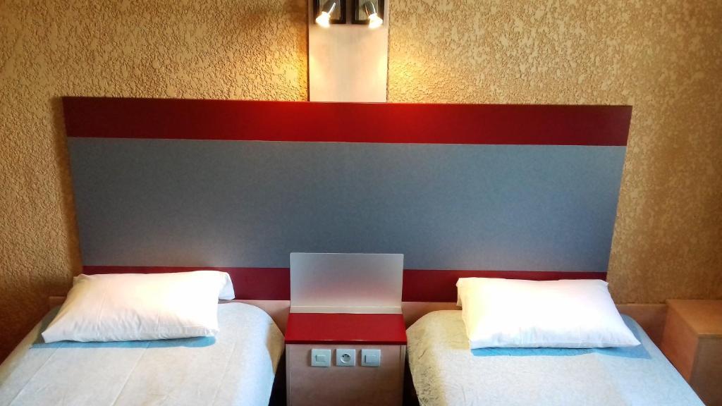Postel nebo postele na pokoji v ubytování Libre Hôtel