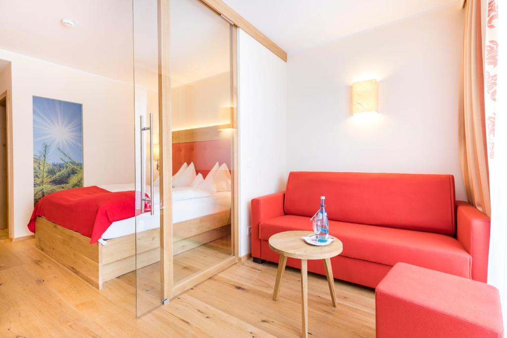 Postel nebo postele na pokoji v ubytování Hotel Alpenland