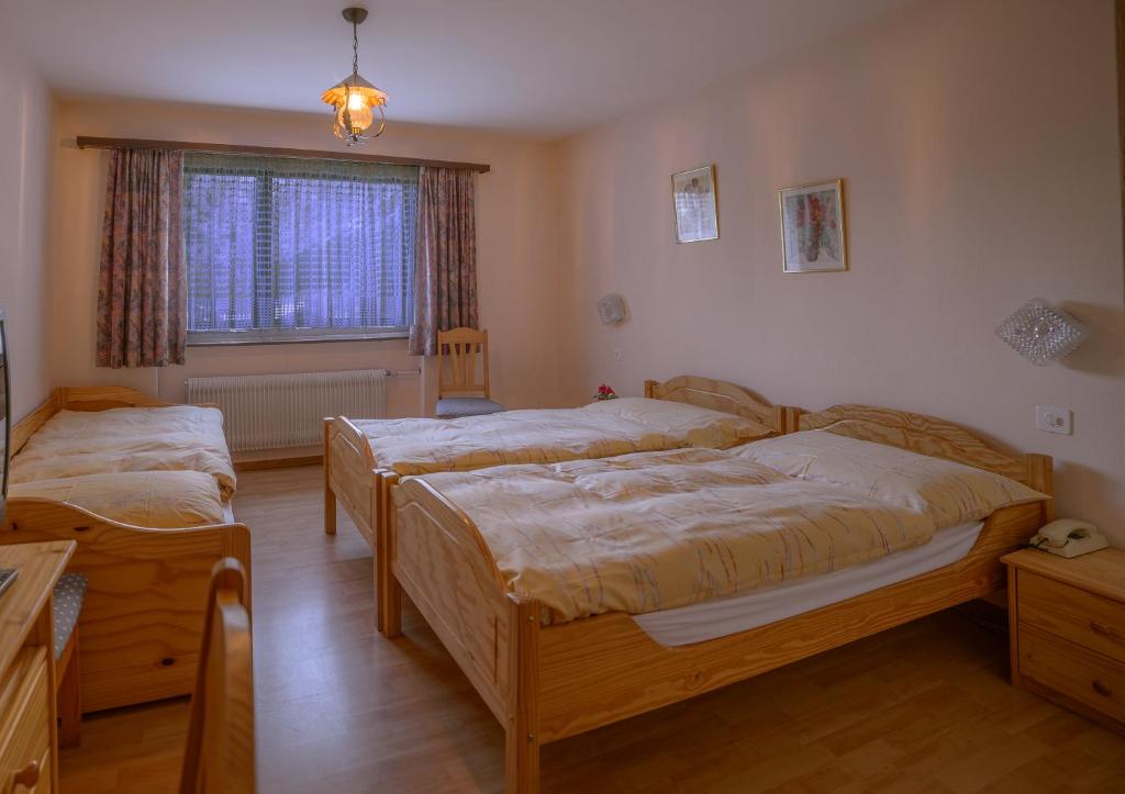 Postel nebo postele na pokoji v ubytování Hotel Olympia