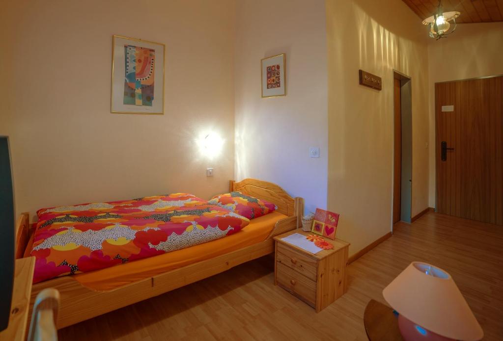 Postel nebo postele na pokoji v ubytování Hotel Olympia