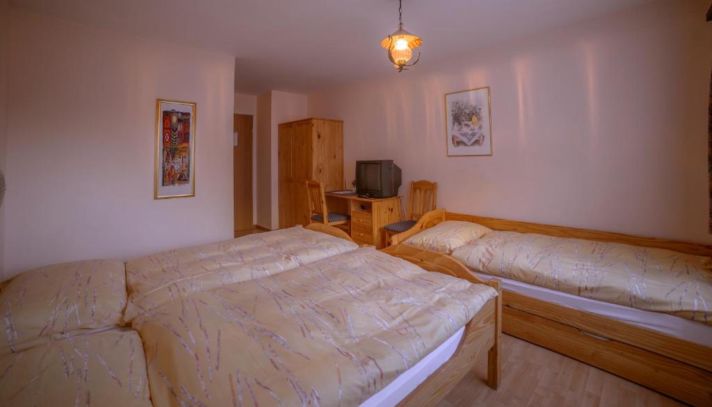 Postel nebo postele na pokoji v ubytování Hotel Olympia