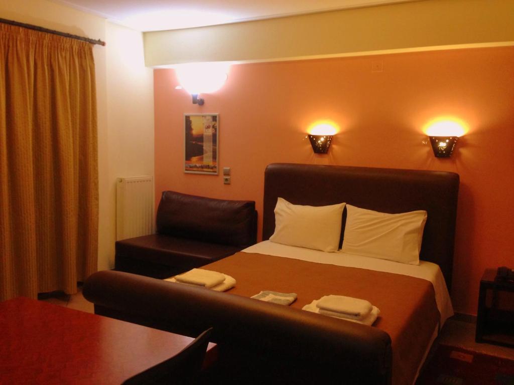Łóżko lub łóżka w pokoju w obiekcie Lirio Guest House