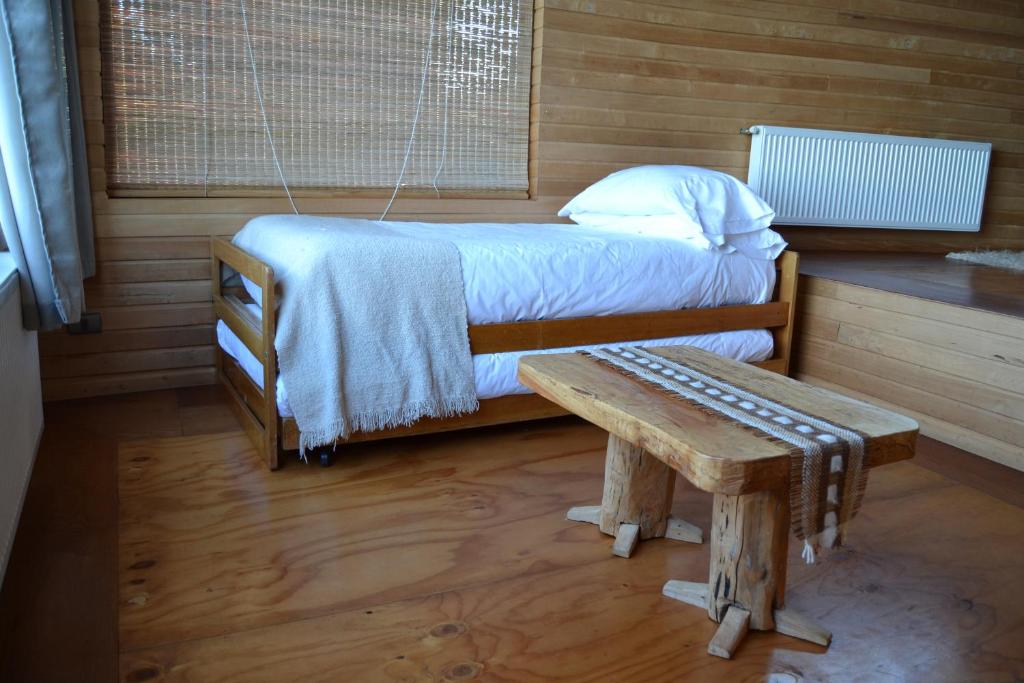 Postel nebo postele na pokoji v ubytování Refugio Pullao