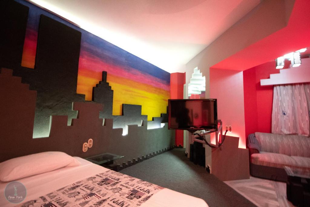 Postel nebo postele na pokoji v ubytování New York Hotel/Motel