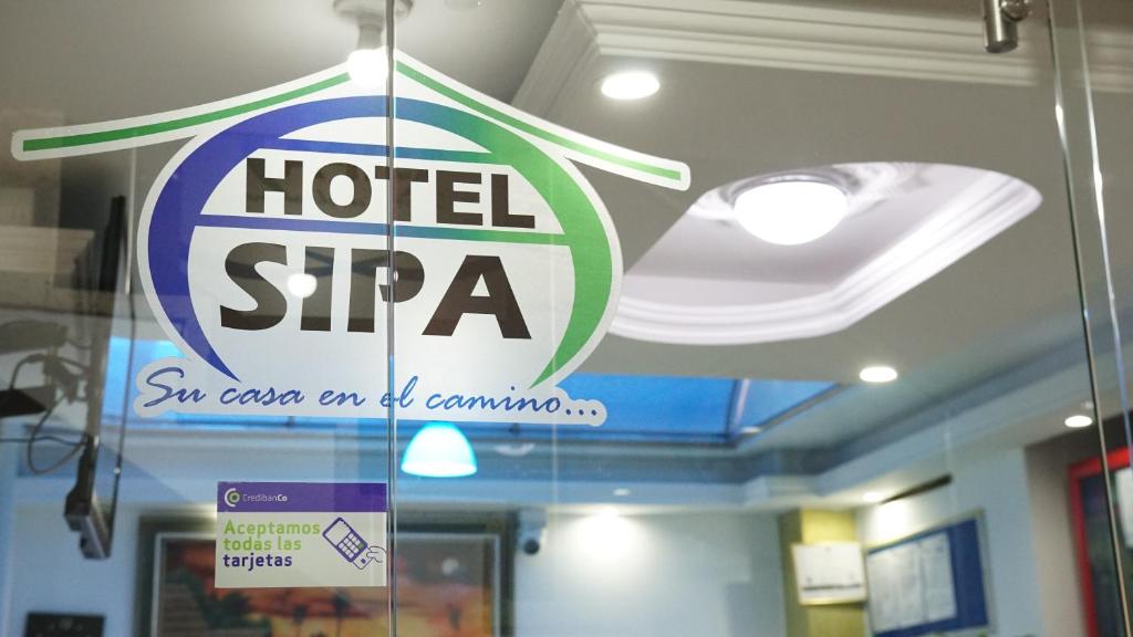 a sign for a hotel sta on a window at Hotel Sipa in Duitama