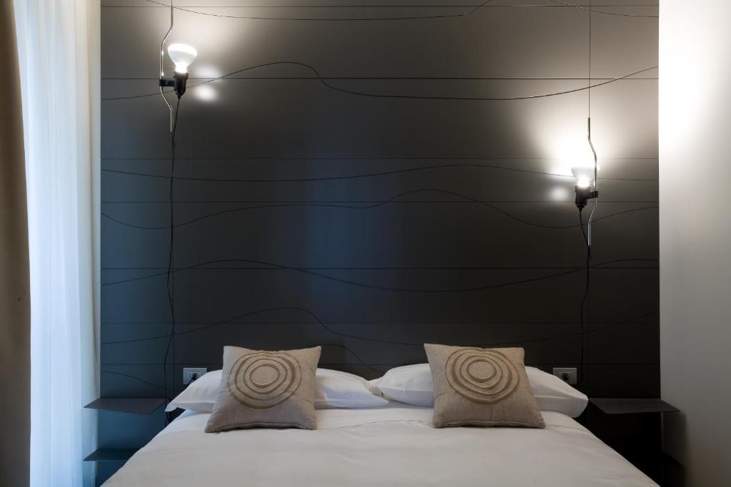 Postel nebo postele na pokoji v ubytování Eos Hotel