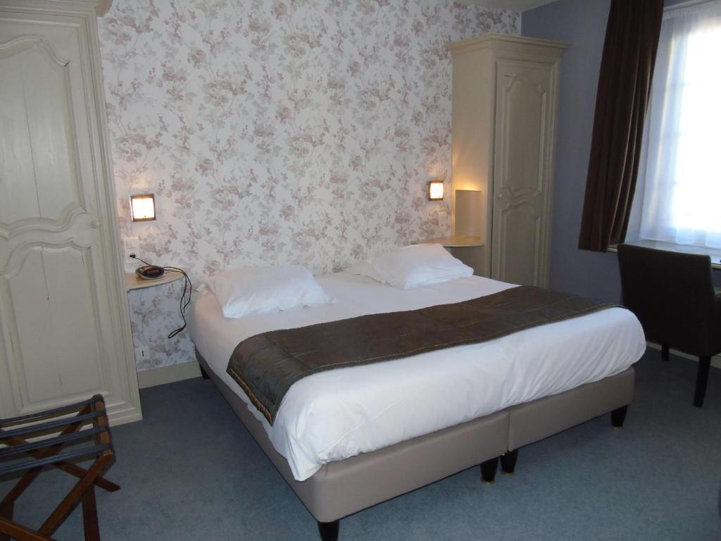 Postel nebo postele na pokoji v ubytování Best Western Hôtel Montgomery