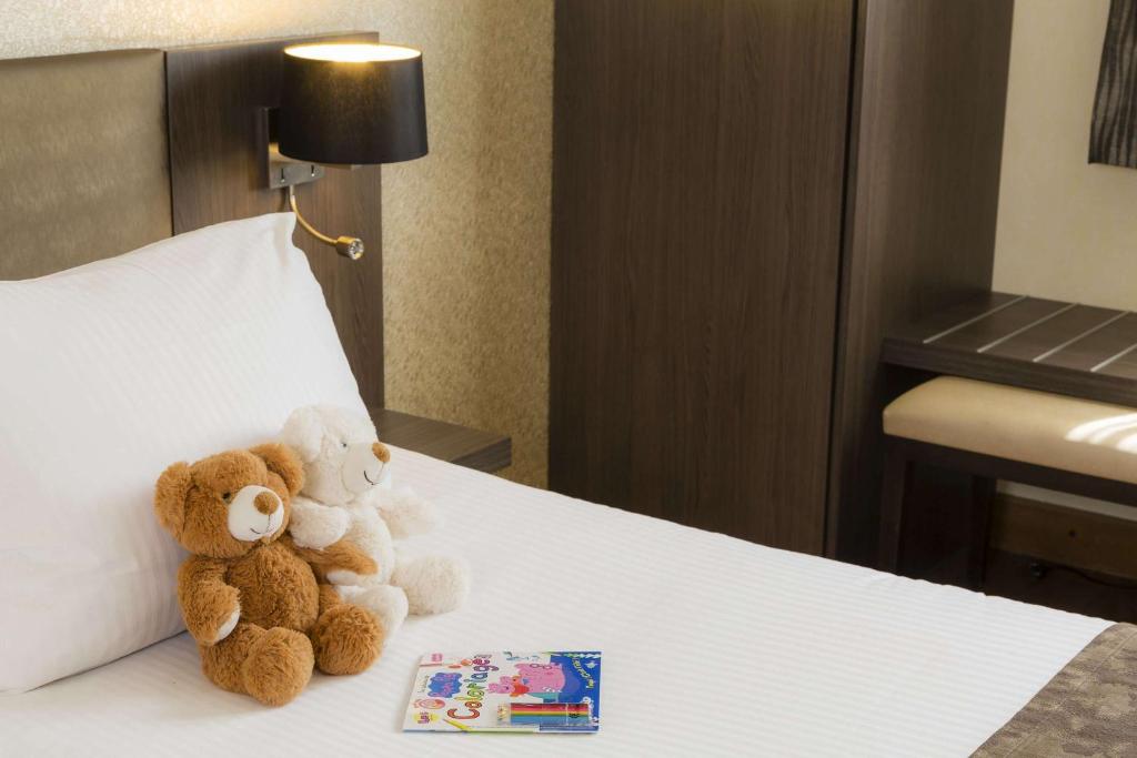 Postel nebo postele na pokoji v ubytování Best Western PLUS Elixir Grasse