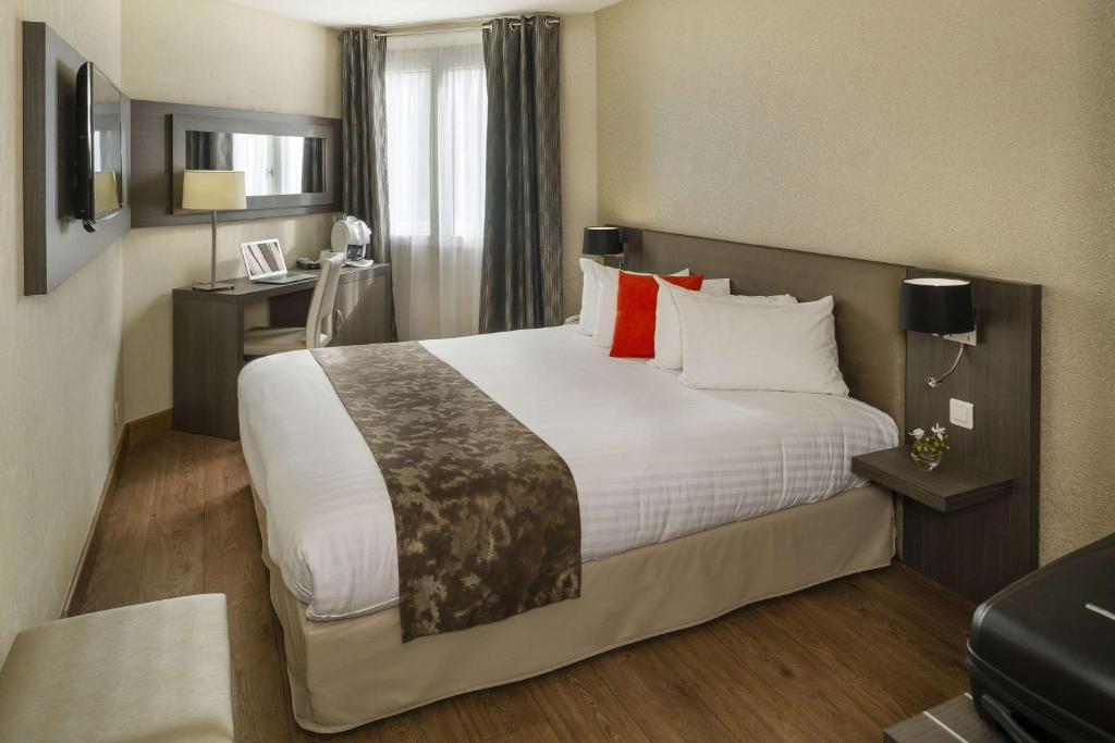 Postel nebo postele na pokoji v ubytování Best Western PLUS Elixir Grasse
