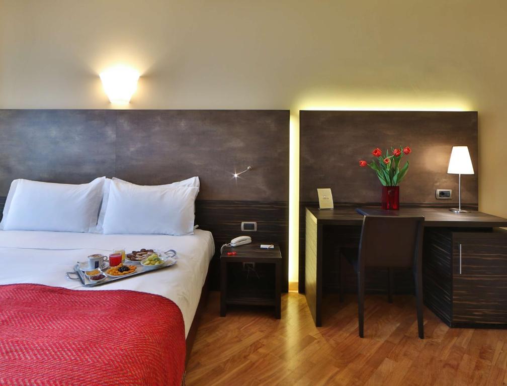 Postel nebo postele na pokoji v ubytování Best Western Hotel Metropoli
