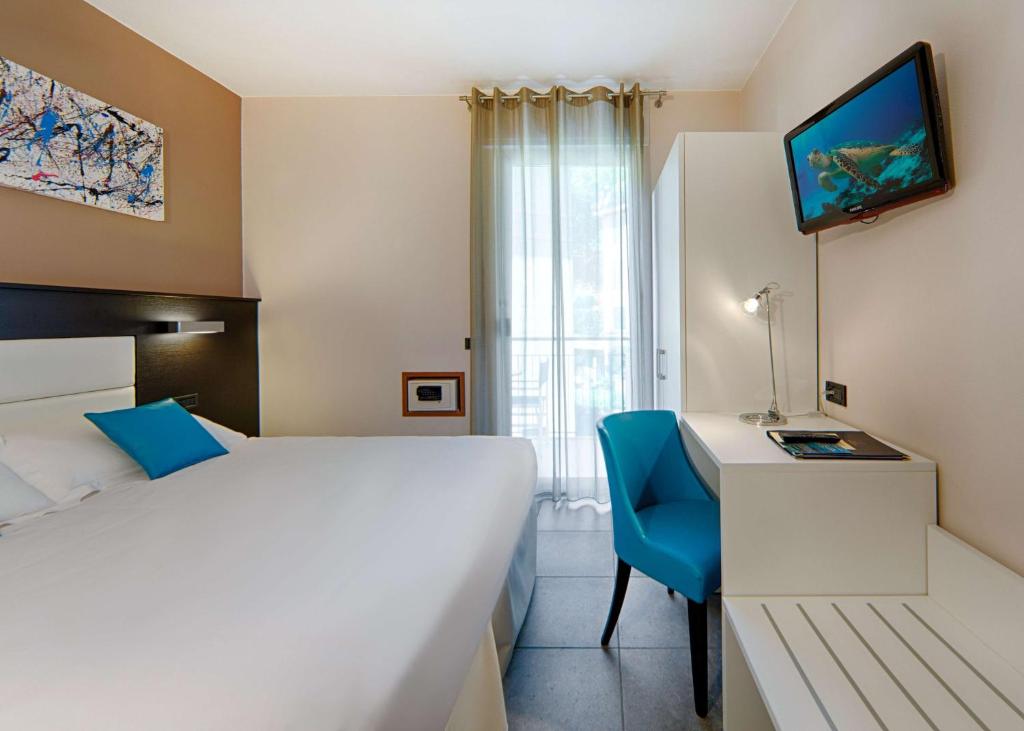 Postel nebo postele na pokoji v ubytování Best Western Regina Elena