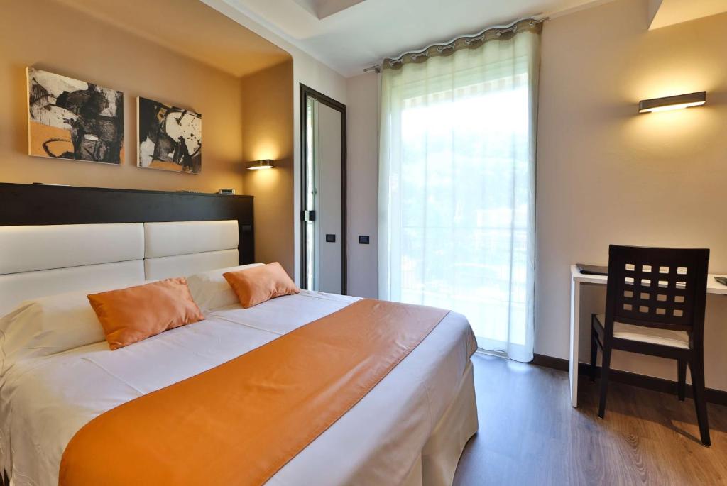 Postel nebo postele na pokoji v ubytování Best Western Regina Elena