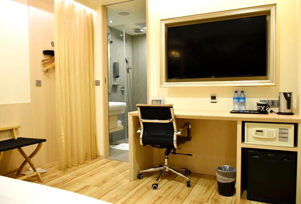 TV a/nebo společenská místnost v ubytování FX Hotel Tainan