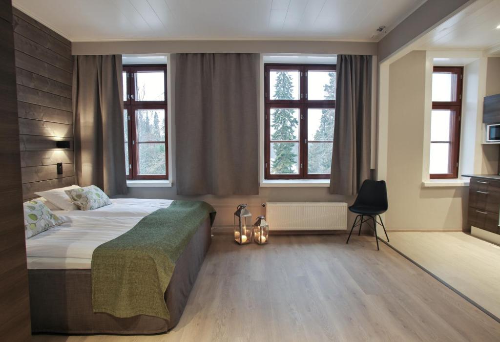 Postel nebo postele na pokoji v ubytování Hotel Metsähirvas
