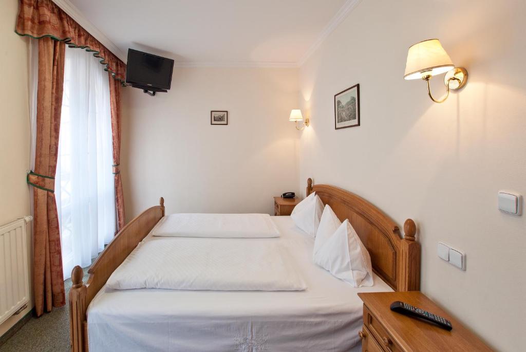 Postel nebo postele na pokoji v ubytování Villa Rosa
