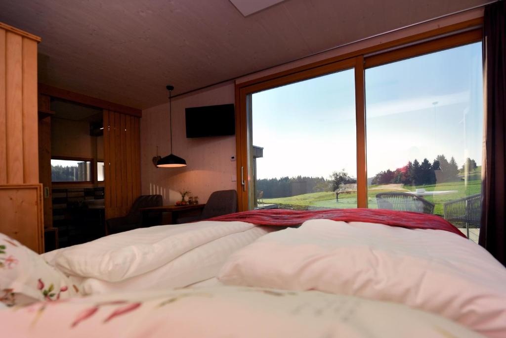 Postel nebo postele na pokoji v ubytování roo'n Lodges#KOLM
