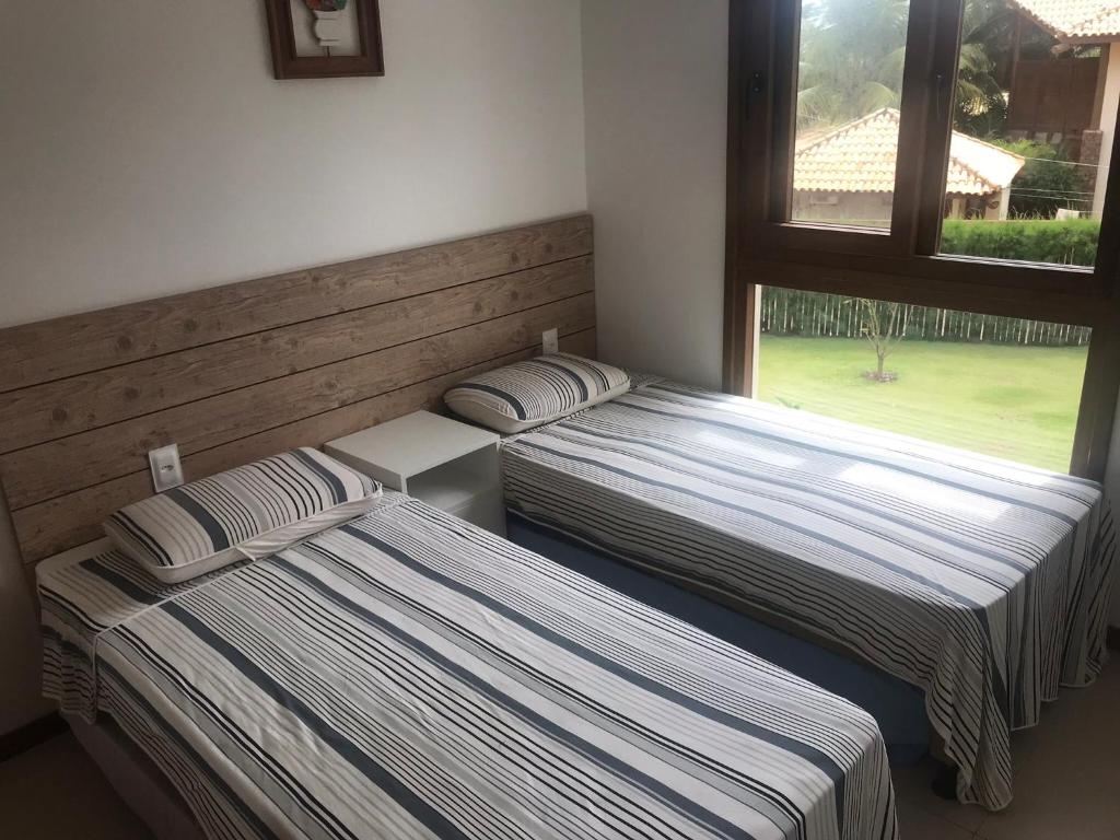 Postel nebo postele na pokoji v ubytování Bali Bahia Itacimirim